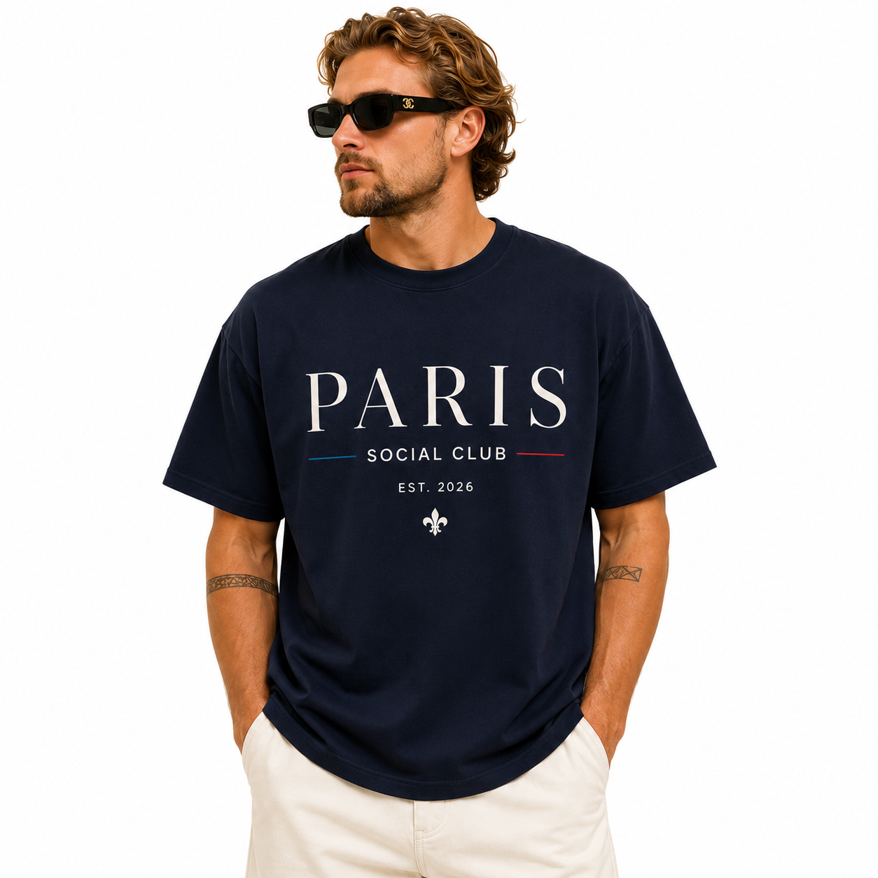 Man wearing a navy blue Paris Social Club graphic T-shirt with short sleeves and crew neck
