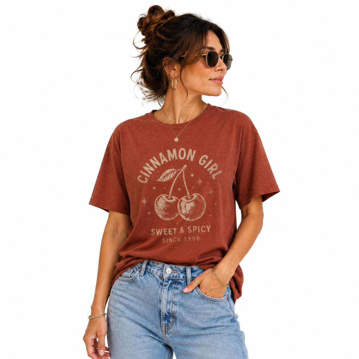 Woman wearing Raheelo Cinnamon Girl vintage oversized cotton graphic T-shirt in washed cinnamon color.