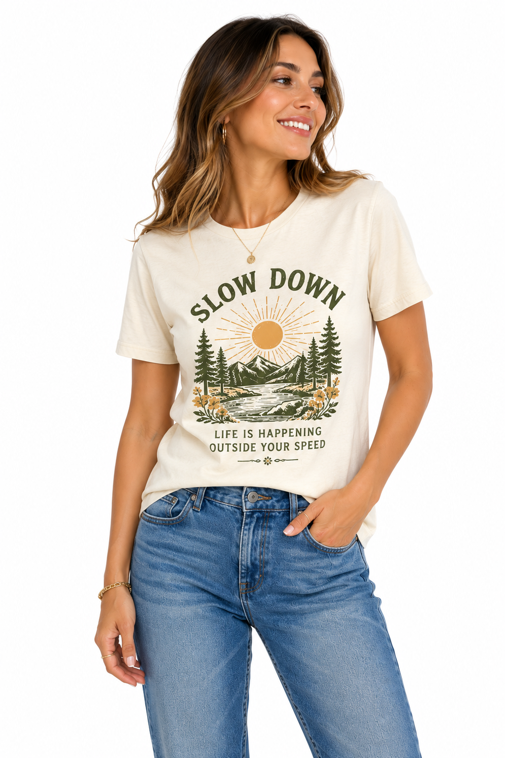 Woman wearing a cream short-sleeve graphic T-shirt with Slow Down text and a mountain landscape print