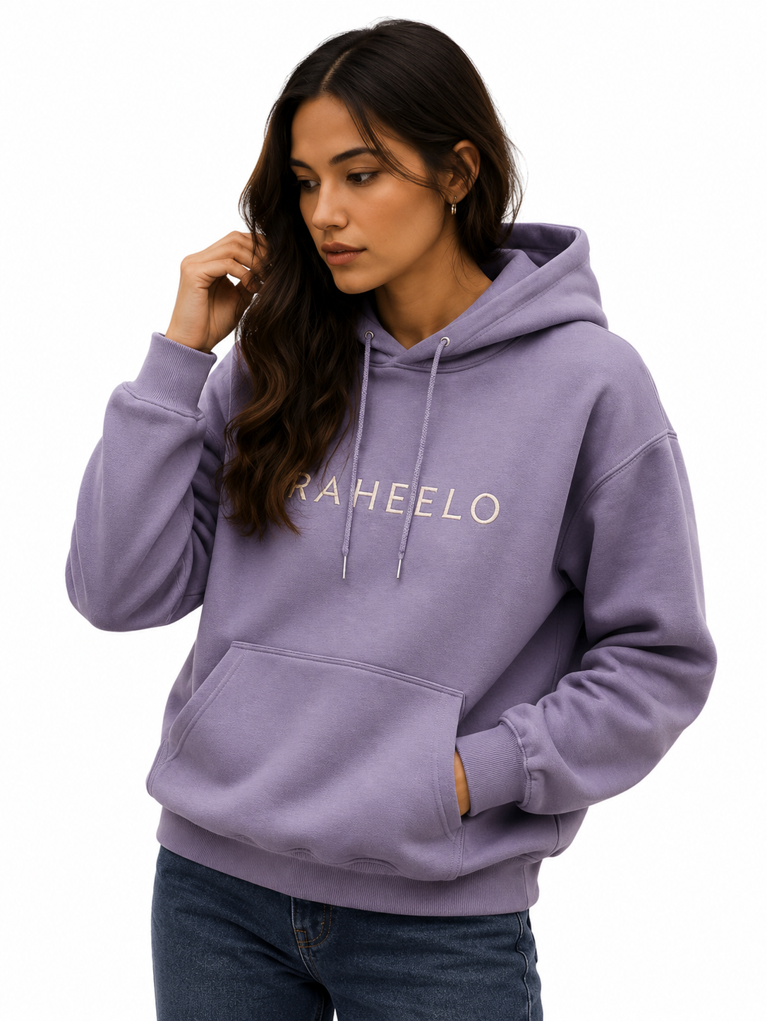 Woman wearing a lavender pullover hoodie with embroidered Raheelo logo, drawstrings and a front kangaroo pocket.